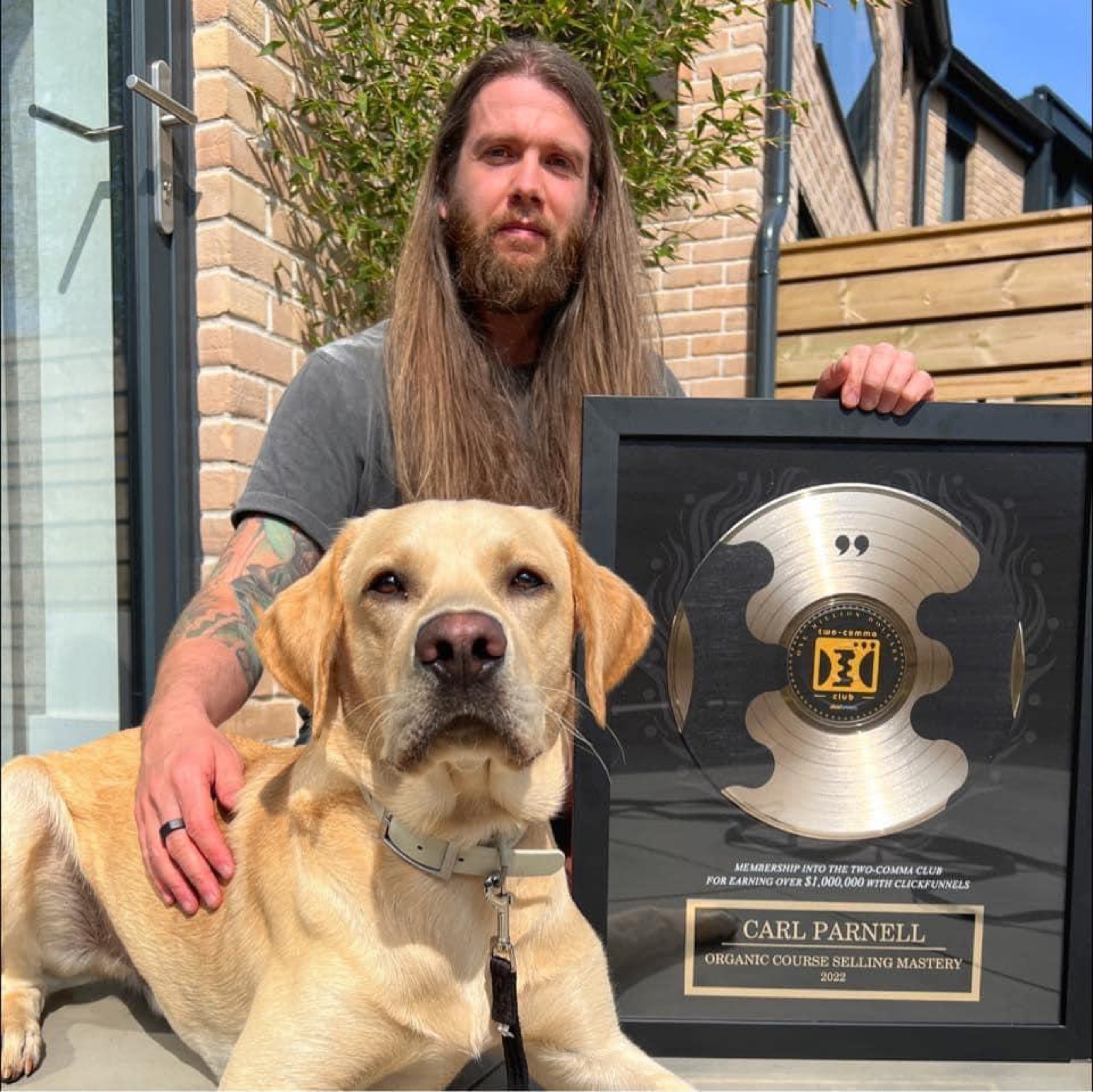 Carl and Baxter with the award